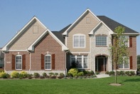 Custom Home Exterior, Hand-Carved Front Door, Wood Shutters, Arched Entry; Indianapolis, Indiana