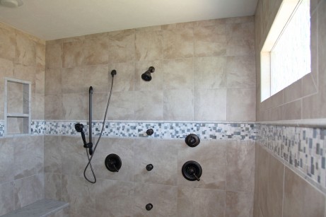 Walk-In Double Shower in Master Bathroom with Hand-Held Shower Head; Multiple Full-Body Shower Heads; Granite Tile, Built-In Toiletry Shelves, Bench; Textured Window